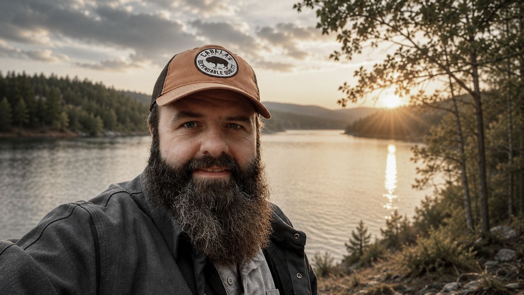 Outdoor Crusade founder Jody Blackwelder beside a lake at sunset in the Appalachian foothills
